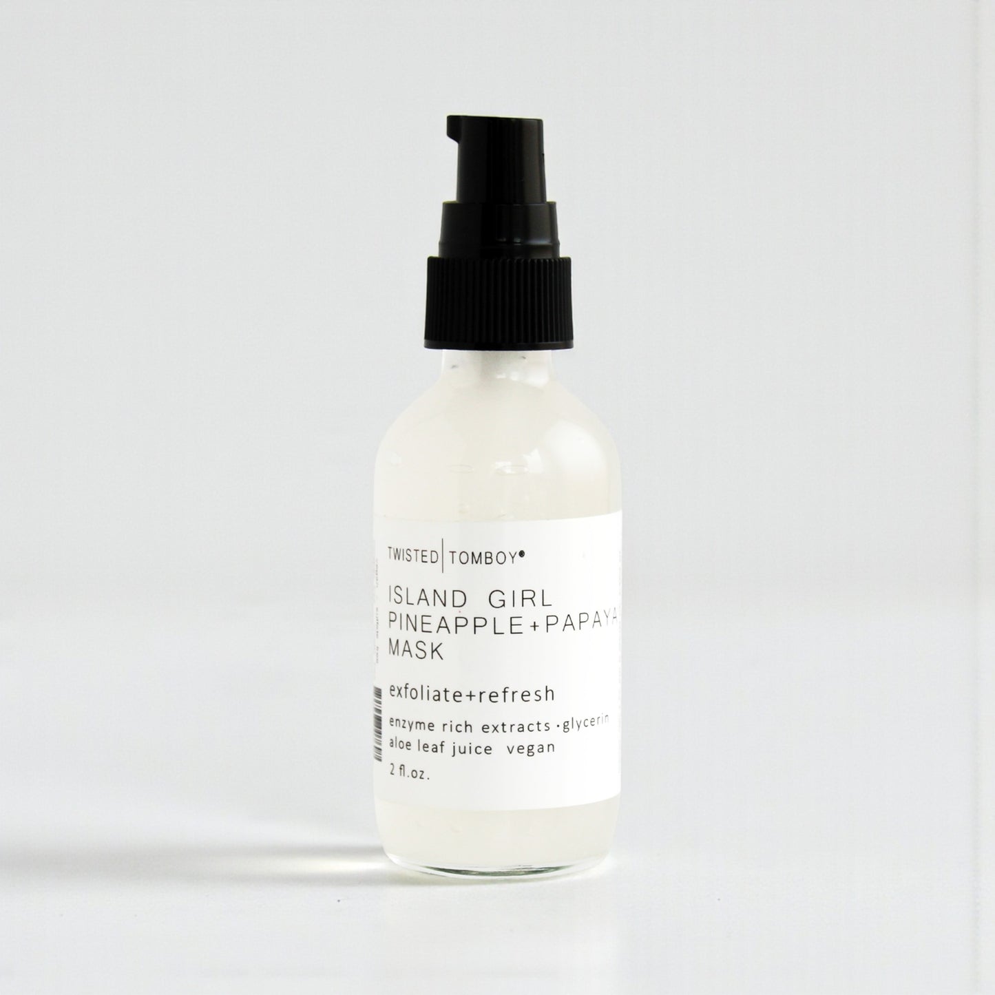 Island Girl Pineapple+Papaya Enzyme Face Mask in a clear bottle with a pump dispenser.