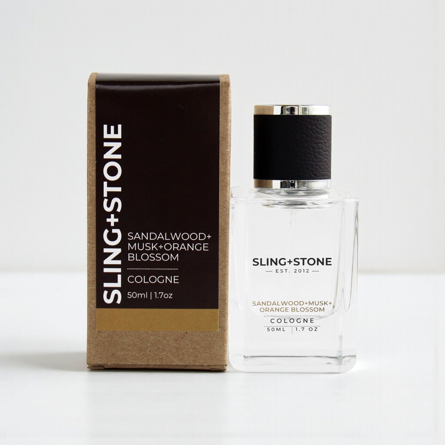 FOR HIM | COLOGNE with sandalwood, musk, and orange blossom in a clear glass bottle and brown box.