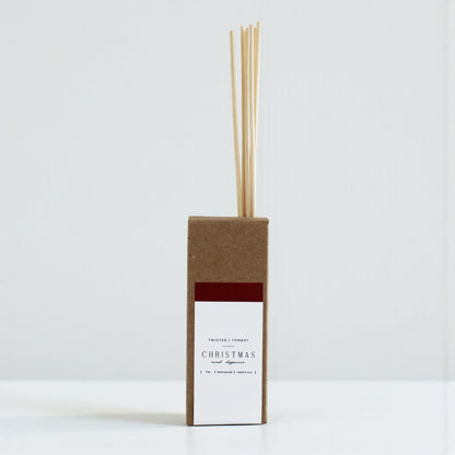 Reed diffusers in six scents, featuring a minimalist brown box design with natural reeds. Perfect for home fragrance.
