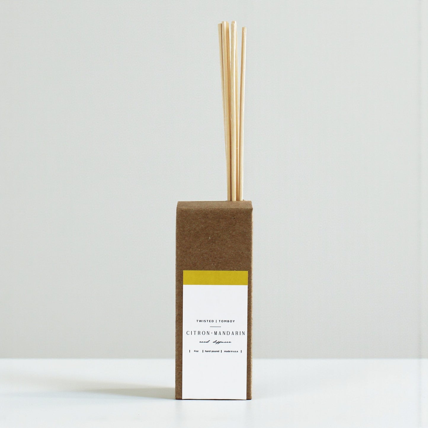 Reed diffusers in six scents, featuring a natural cardboard design and wooden reeds. NEW ARRIVAL!