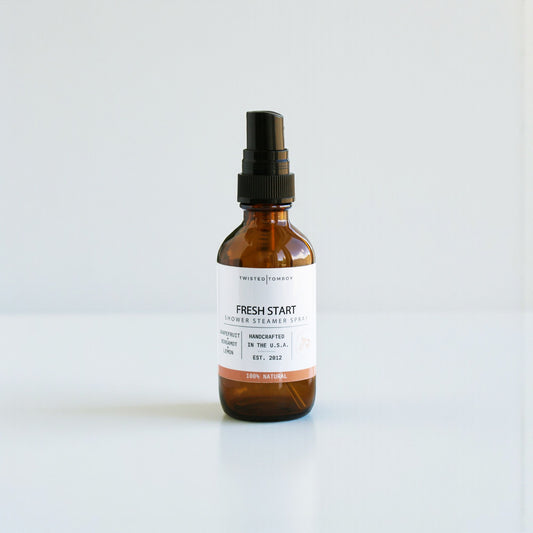 Brown spray bottle labeled 'Fresh Start' on a white background