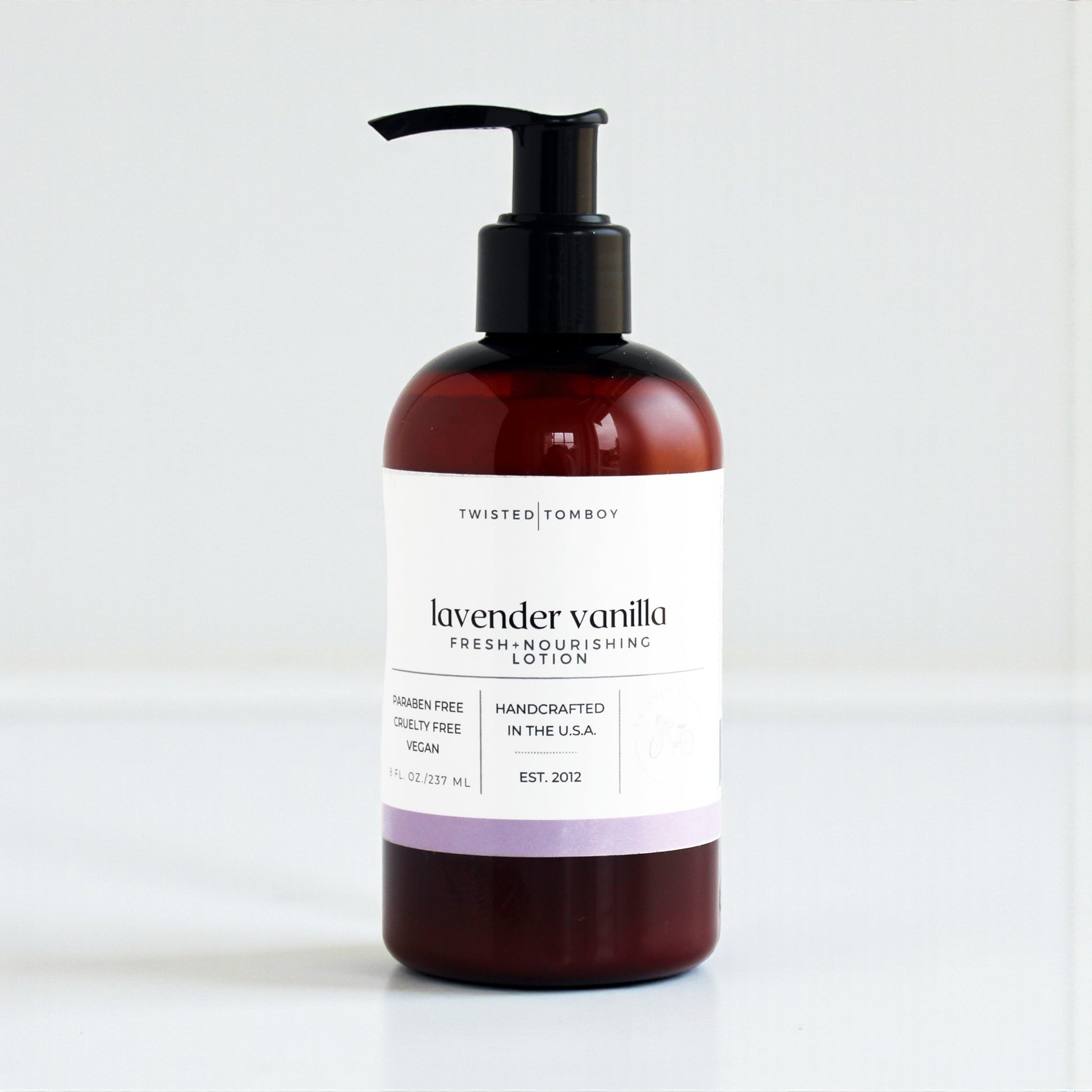 Lavender vanilla lotion bottle with pump on a white background
