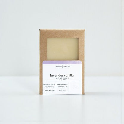 Lavender vanilla goat milk soap in a cardboard box on a white background