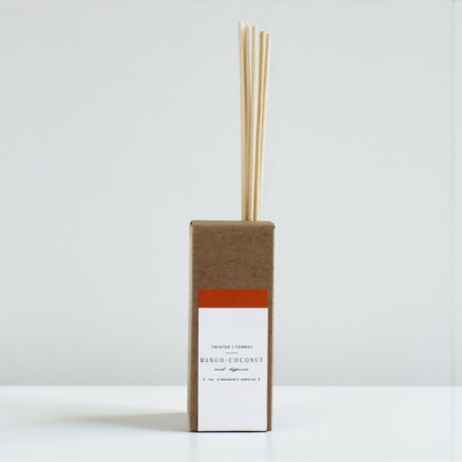 Mango+Coconut reed diffuser with cardboard packaging on a white background