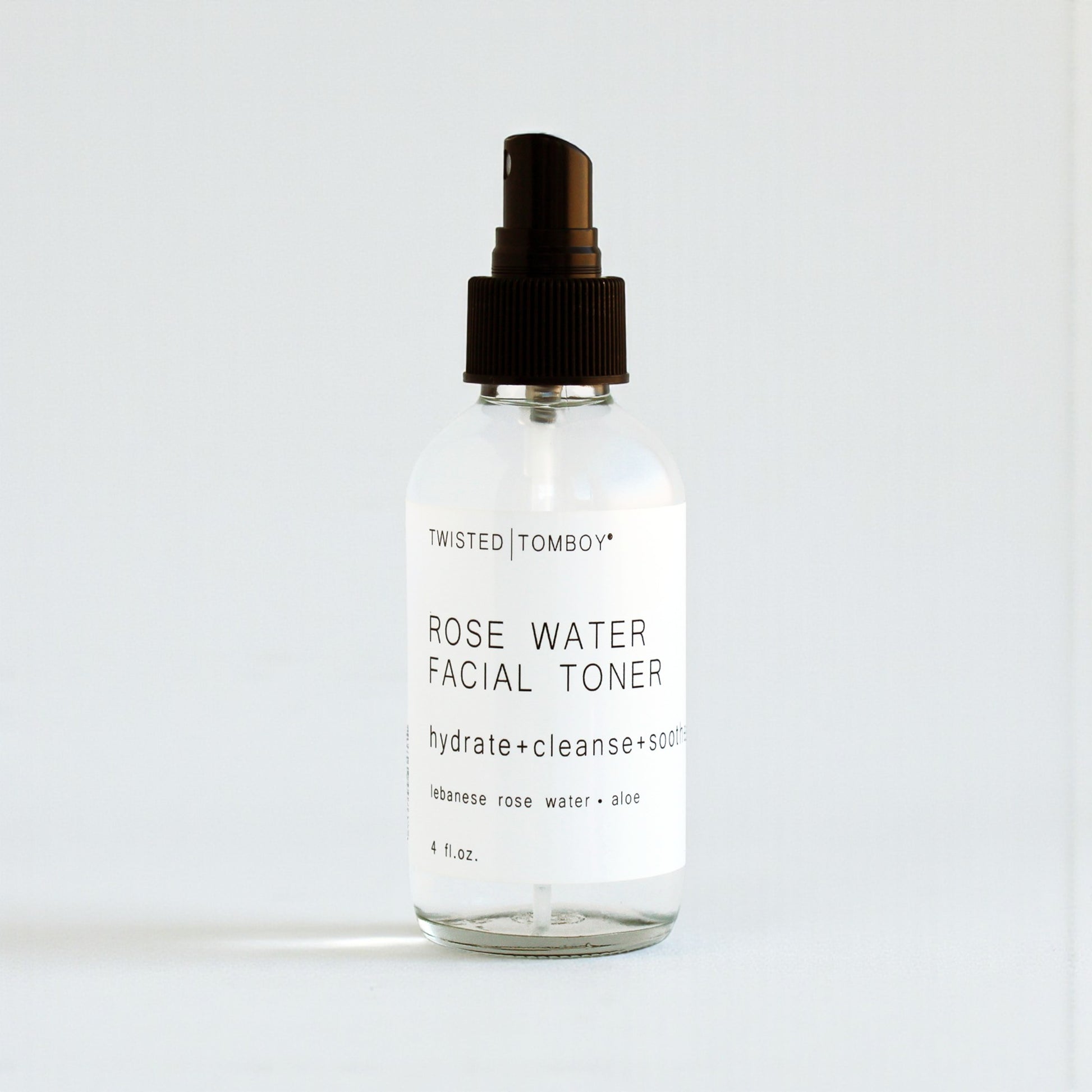 Clear bottle of Twisted Tomboy Rose Water Facial Toner on a white background