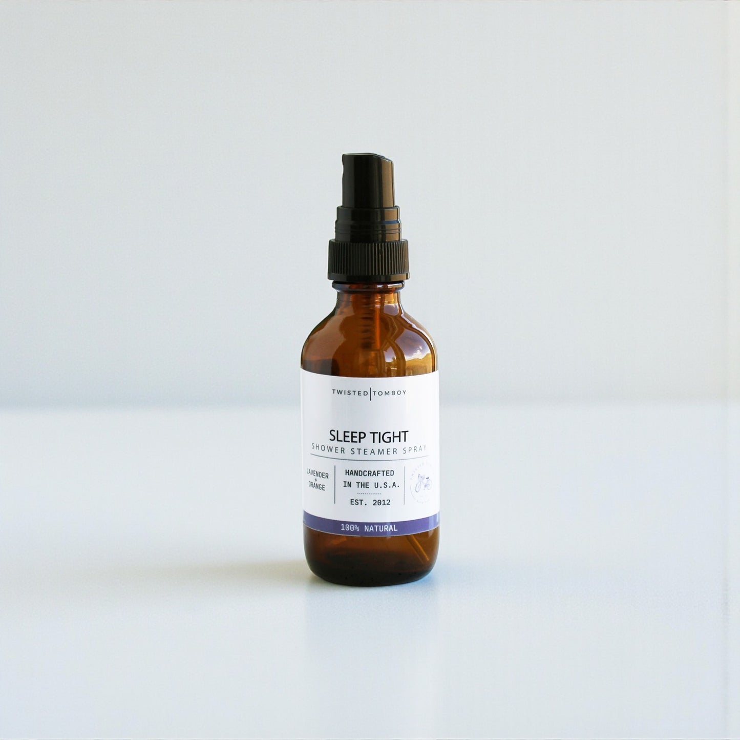 Brown glass bottle with a black spray nozzle on a white background, Sleep Tight