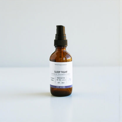 Brown glass bottle with a black spray nozzle on a white background, Sleep Tight