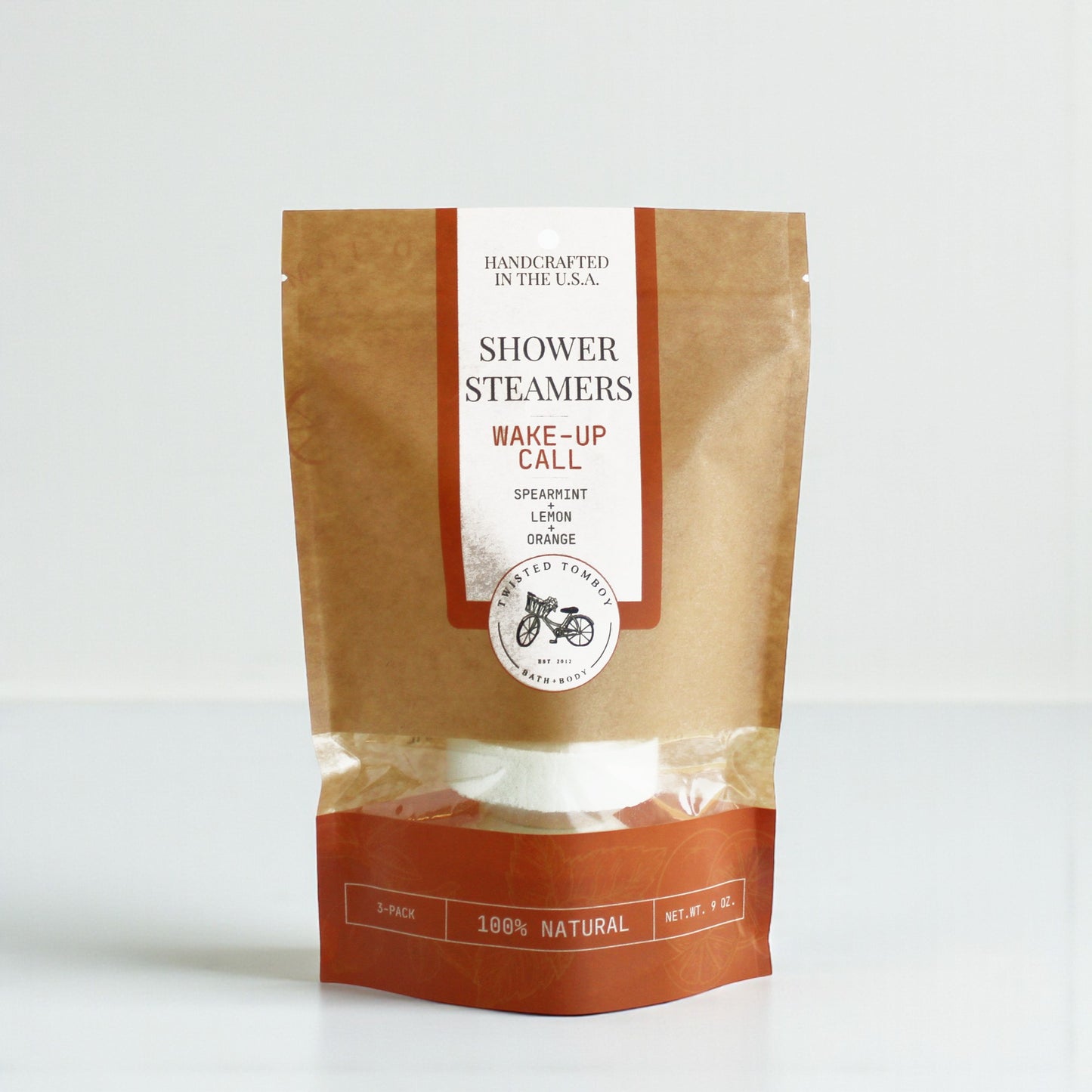 Package of shower steamers labeled 'Wake-Up Call' with a brown and white design on a white background.