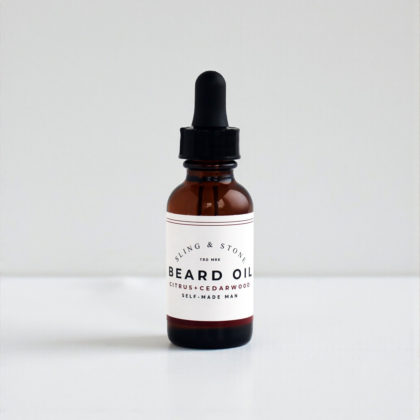 FOR HIM BEARD OIL in amber glass bottle, featuring a citrus and cedarwood scent blend.