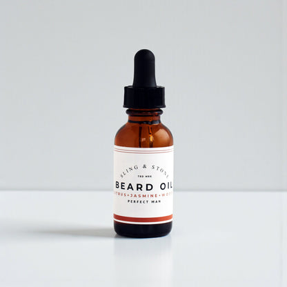 FOR HIM | BEARD OIL | 5-OIL BLEND in amber glass bottle with dropper, featuring citrus, jasmine, and wood scents.