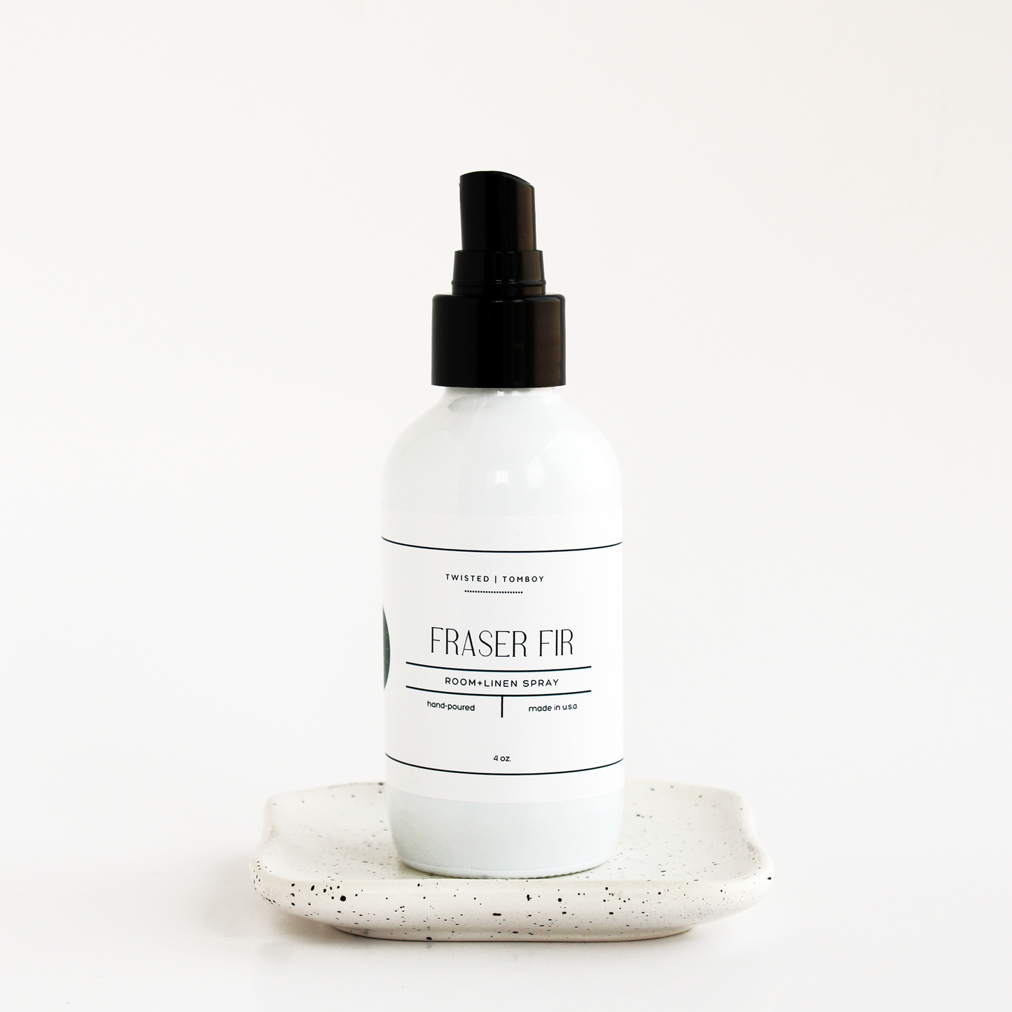 White spray bottle labeled 'Fraser Fir' on a white background