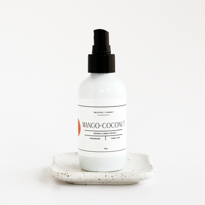 Mango-Coconut room linen spray bottle on a white background