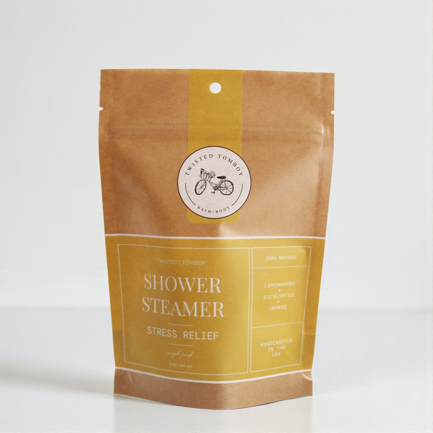 Shower Steamer SINGLES in eco-friendly packaging for stress relief with lemongrass, eucalyptus, and orange scents.