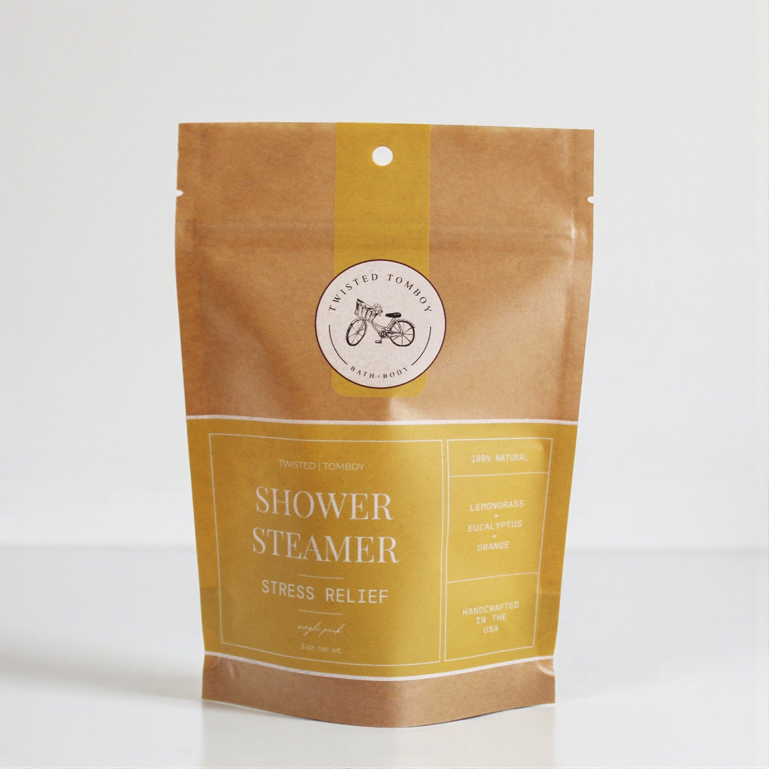 Shower Steamer SINGLES in eco-friendly packaging for stress relief with lemongrass, eucalyptus, and orange scents.