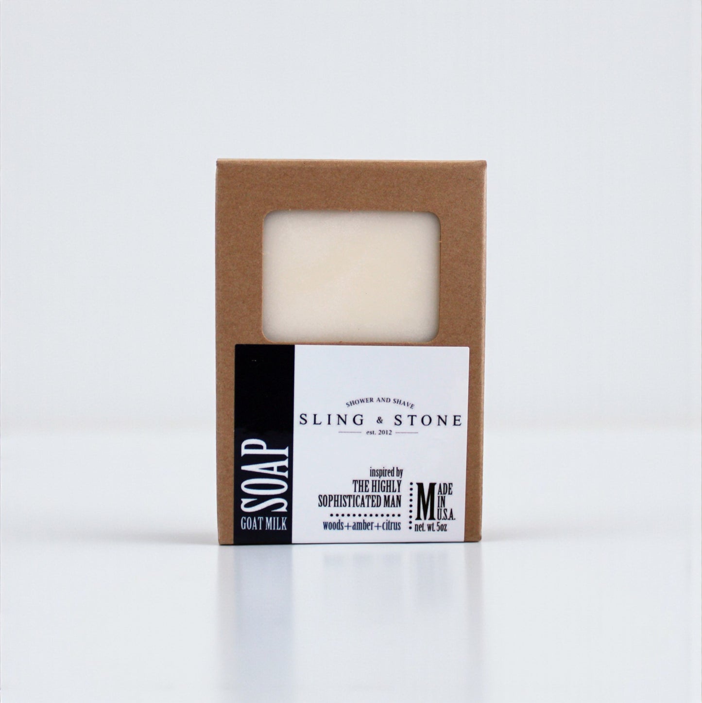 FOR HIM | HAND CRAFTED GOAT MILK BAR SOAP in a simple brown box with a clear window, featuring a minimalist design.
