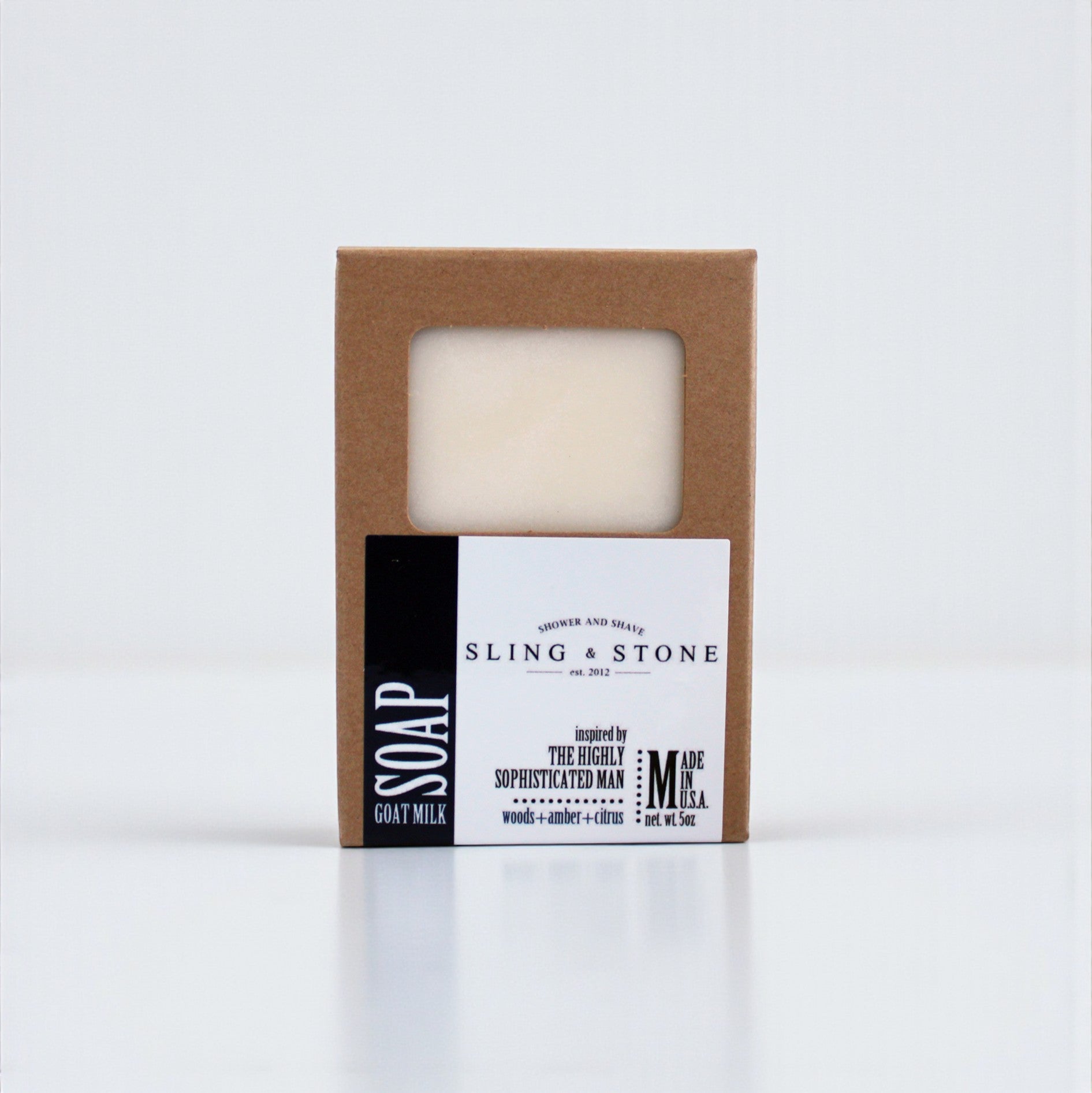 FOR HIM | HAND CRAFTED GOAT MILK BAR SOAP in a simple brown box with a clear window, featuring a minimalist design.
