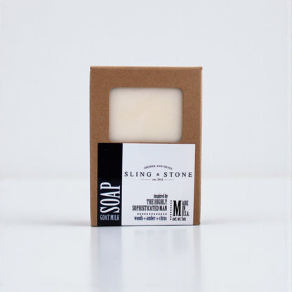 FOR HIM | HAND CRAFTED GOAT MILK BAR SOAP in a simple brown box with a clear window, featuring a minimalist design.