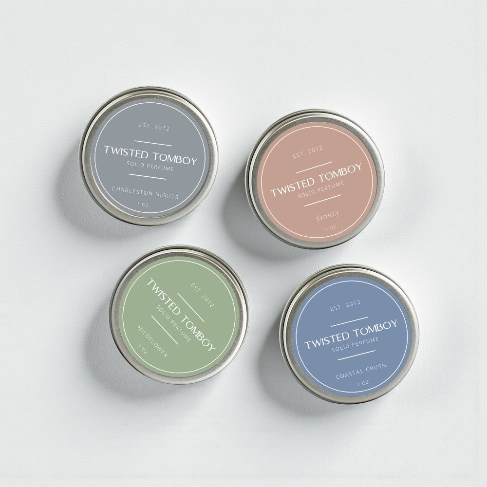 Solid perfume tins in four scents