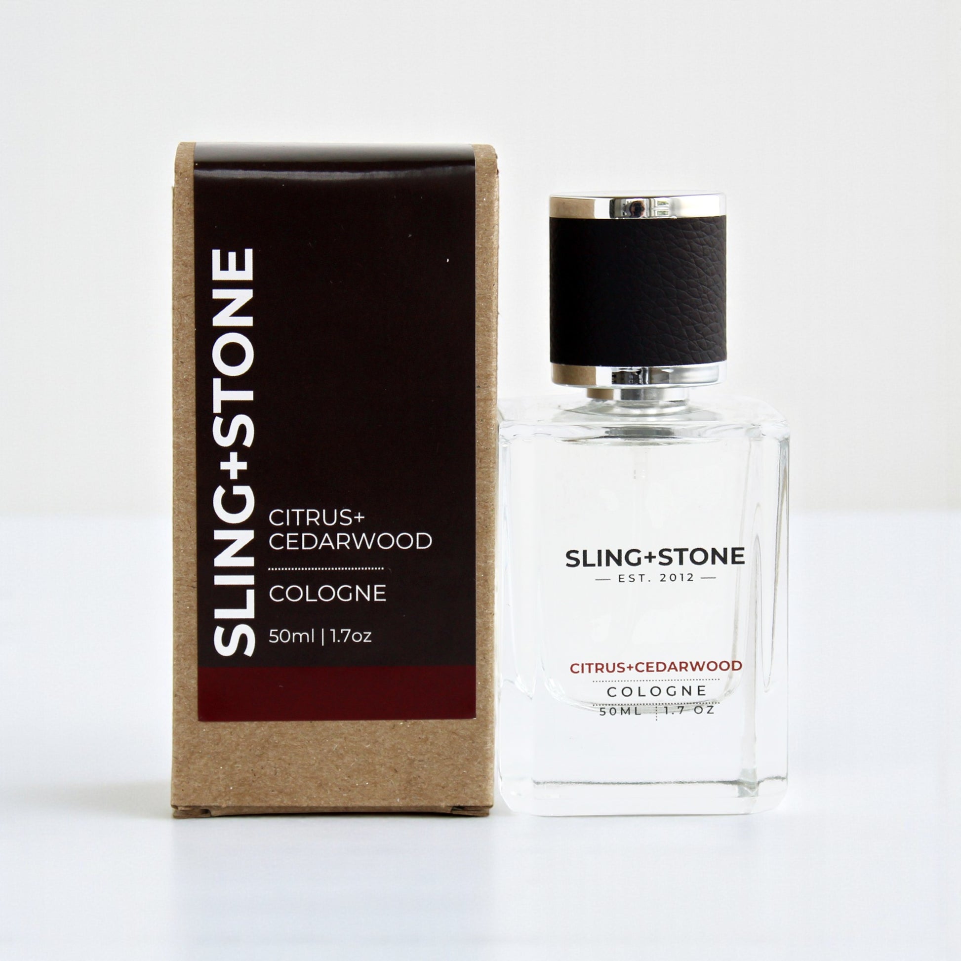 FOR HIM | COLOGNE in a clear bottle with a black cap, featuring a brown box, labeled Citrus + Cedarwood.