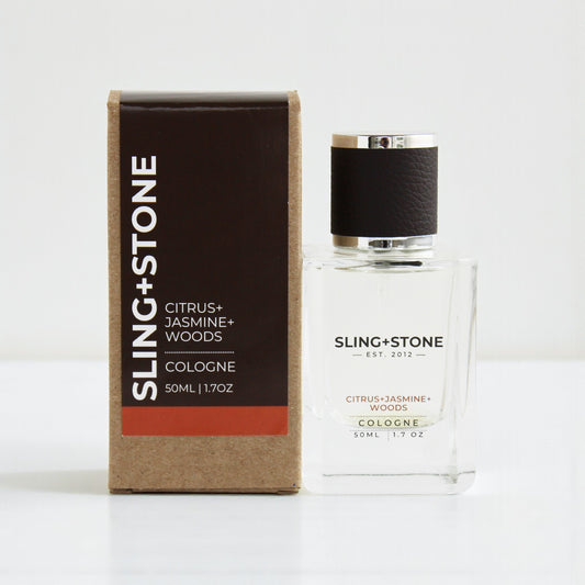 FOR HIM | COLOGNE by SLING+STONE, featuring citrus, jasmine, and woods scents in a clear glass bottle.